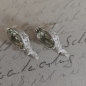 Preview: Ohrstecker mit ovalem Prasiolith und Hirschmotiv aus 925 Silber in schräger Ansicht